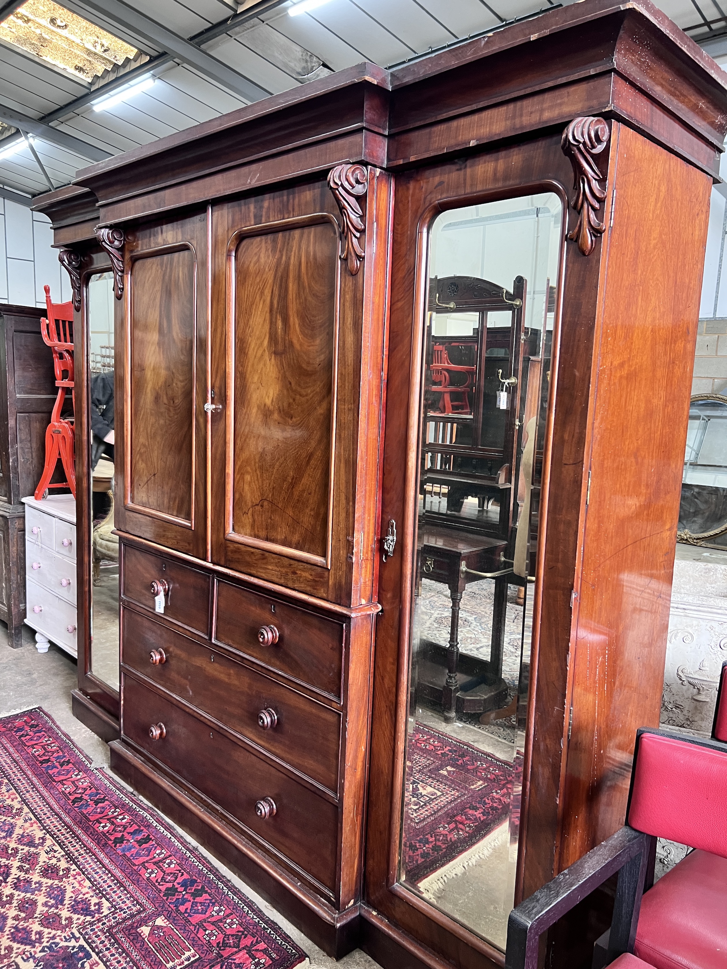 A Victorian mahogany break front mirrored compactum wardrobe, length approx. 240cm, depth 68cm, height 209cm